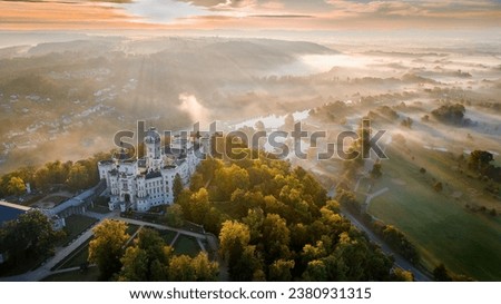 Hluboká nad Vltavou state castle located in the town of the same name in South Bohemia. Captured in autumn at sunrise with morning fog
