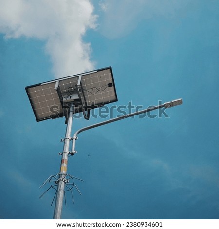 a picture of a front light pole against a blue sky