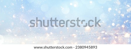 Blurred glitter effects background. Bright soft blue with hints of pearl color. Christmas background
