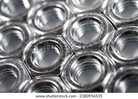 Close up of some metal nuts for fixing of fasteners Royalty-Free Stock Photo #2380956535