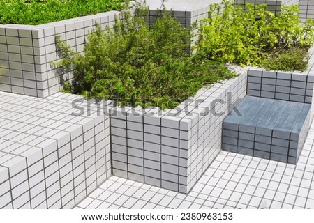 picture of tiled bench installation with plant decorations in public spaces
