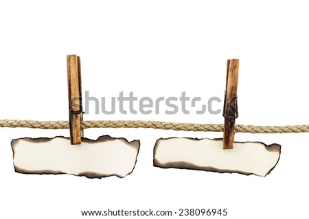 Paper on clothespins isolated on white