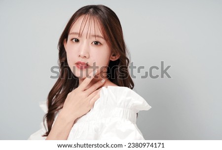 Beauty portrait of beautiful Asian girl. Skin care. Cosmetics. Makeup. Hair removal.