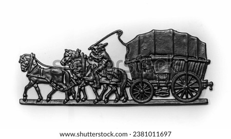 Cast iron bas-relief in the form of three horses harnessed to a carriage with a coachman close-up on a white background