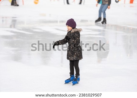 teenage girl skating outdoor, ice rink
