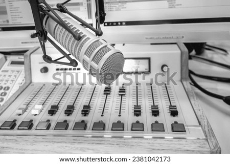 Professional microphone and sound mixer in radio station studio Royalty-Free Stock Photo #2381042173