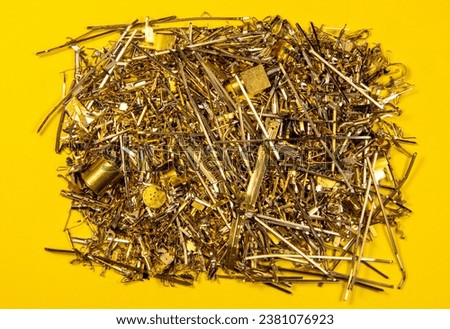 A close-up of waste from electronic industrial components containing gold Royalty-Free Stock Photo #2381076923