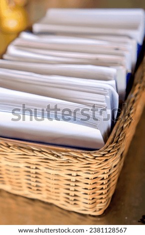 a basket full of papers.
