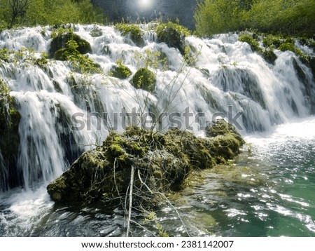 Low shutter speed of beautiful waterfalls, Plitvice lakes national park UNESCO, dramatic unusual scenic, green foliage alpine forest, biological diversity, hiking trails, nature background.