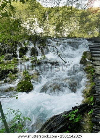 Low shutter speed of beautiful waterfalls, Plitvice lakes national park UNESCO, dramatic unusual scenic, green foliage alpine forest, biological diversity, hiking trails, nature background.