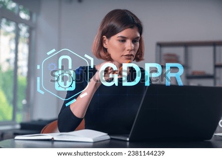 Pensive attractive beautiful businesswoman in formal wear working on laptop at office workplace in background. Concept of data protection information technology. Lock icon hologram. Notebook, table.