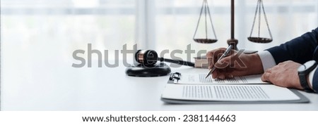 Young Asian lawyers or lawyers sitting analyzing business deals on real estate financial documents at the office panorama, banner, copy space Royalty-Free Stock Photo #2381144663