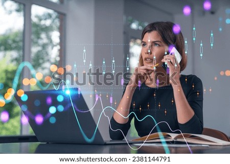 Pensive attractive beautiful businesswoman in working on laptop, talking phone, office workplace in background. Forex graph and charts hologram icons. Concept of market trading and research.