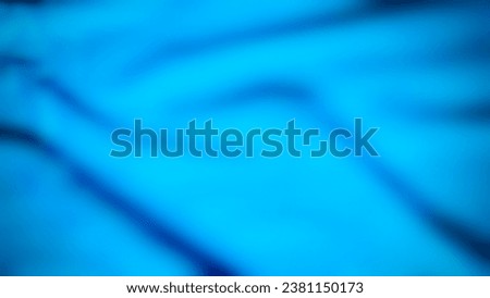 The turquoise background has beautiful shadow lines that are blurred to add darkness.