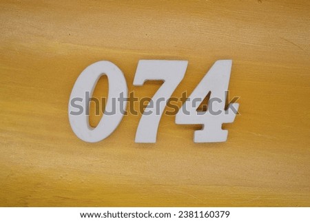 The golden yellow painted wood panel for the background, number 074, is made from white painted wood.