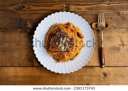 Pasta in tomato sauce with sausage