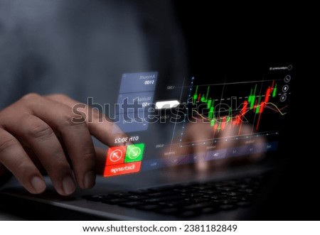 Photo mixed with graphics of man using hand to touch investment graph, virtual screen in front of laptop, investment strategy concept.