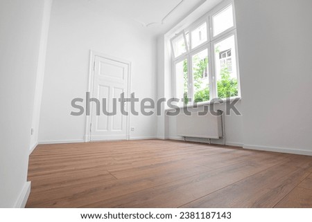 empty apartment room,window and flat door,  low angle view Royalty-Free Stock Photo #2381187143