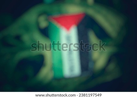 The image does not focus on Palestinian attributes with foliage in the background