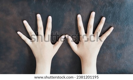 cute right hand with a brown background