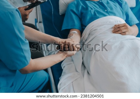 Injured patient showing doctor broken wrist and arm with bandage in hospital office or emergency room. Sprain, stress fracture or repetitive strain injury in hand. Nurse helping customer. First aid. Royalty-Free Stock Photo #2381204501