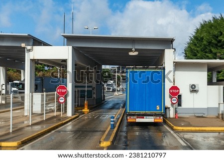 Truck in a customs control at the exit of the port of Algeciras. Royalty-Free Stock Photo #2381210797
