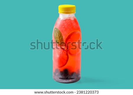 Bubble gum lemonade with currants, lime, mint, bubble gum syrup, ice, soda water on green background for food delivery website