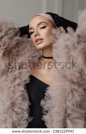 Retro Woman in Black Dress, Fur Cloak, Beauty Flapper Portrait, Old Fashioned Hairstyle, Luxury Lady over Grey Background Royalty-Free Stock Photo #2381229941