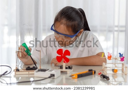 Young girl Learning robotics basics