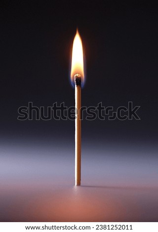 the smoke of burning a matchstick on a black background Royalty-Free Stock Photo #2381252011