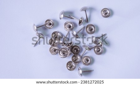 Picture of nails driven in, with white background, macro photography