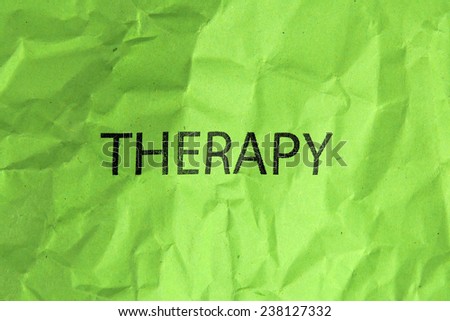 word therapy on crumpled green paper