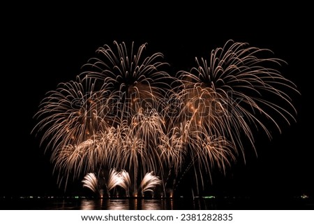 PATTAYA, CHONBURI, THAILAND, Real Fireworks at Pattaya bay, Pattaya national Fireworks Festival contest, November of every Year, Beautiful of bright light fireworks Show in middle sea, for postcard, Royalty-Free Stock Photo #2381282835