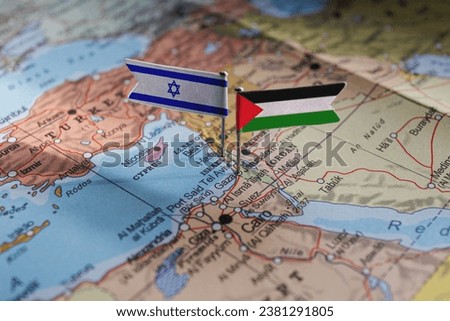 Jarusalem, Israel - 2023 October 14: Israel an Palestine flags on geopolitical Map. Gaza strip and West Bank. War conflict Royalty-Free Stock Photo #2381291805