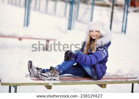 portrait of a funny girl on a walk in the winter. teen outdoors
