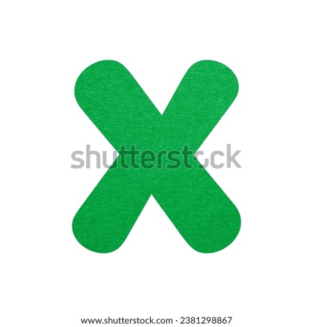 Green paper letter X isolated on white background. Alphabet series.