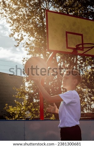 Sunset Serenity: Teenage Baller Masters the Court as Daylight Fades
