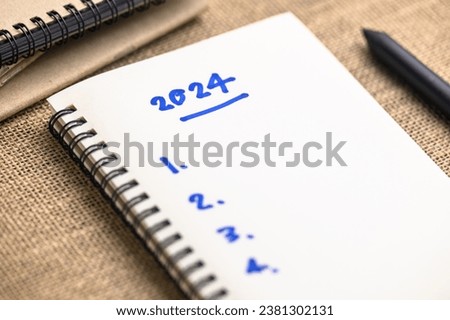 2024 Year with list of things to do as note on the notebook, new year resolutions, 2024 goal setting Royalty-Free Stock Photo #2381302131