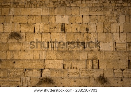 The stones of the Western wall (Wailing Wall), the Jewish shrine, at Jerusalem Old Town during the night in Israel. Royalty-Free Stock Photo #2381307901