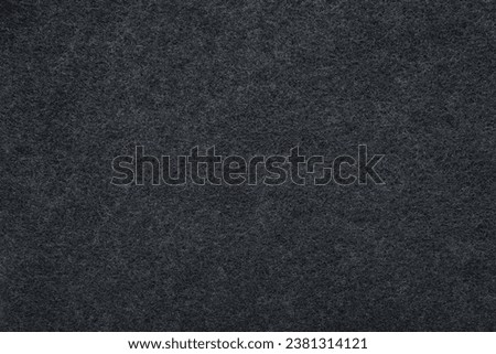 Background of new dark black charcoal filter for kitchen cooker hood. Closeup.