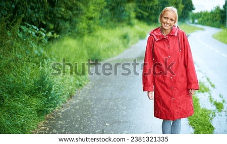Woman, smile and raincoat in outdoor rain, wet and cold from weather, winter and nature. Happy female person, road and red jacket is trendy, rainfall and protection from water, face and holiday