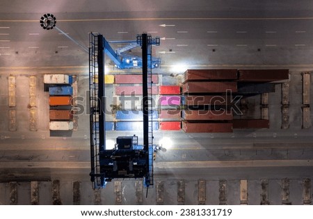 RTG cranes are lifting containers at the port.

 Royalty-Free Stock Photo #2381331719