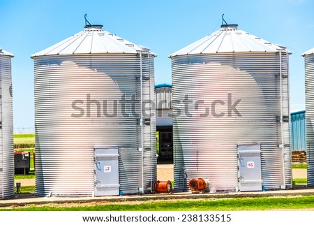 Canisters for the pre-processing of peanuts on a farm.