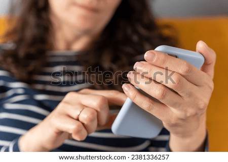 women's hands that confidently hold a smartphone, modern technology