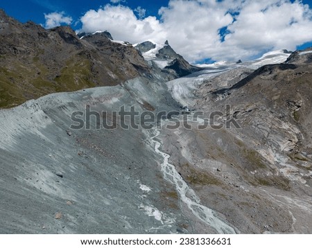 Aerial picture of the Findel Glacier in Zermatt in Switzerland, Drone shot in the summer of the Findelgletscher that becomes every year smaller because climate change