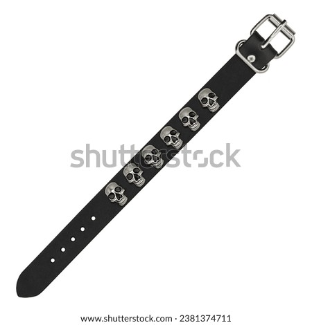 Black leather bracelet with spikes, holnitenes. An accessory for rockers, bikers, metalheads, goths and punks. Steampunk style. Close-up subject photography.
