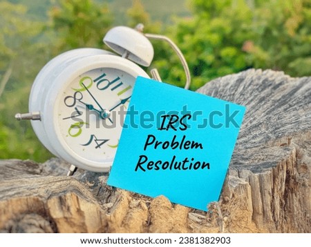 Business Concept - IRS Problem Resolution text on paper with nature background. Stock photo.