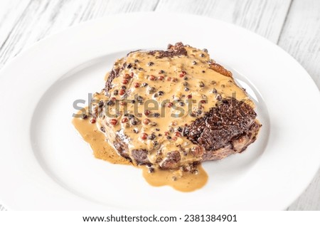 Steak au poivre - french steak with peppercorn sauce Royalty-Free Stock Photo #2381384901