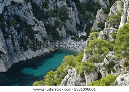 Beach and limestone cliffs in the Calanque d'En-vau. Calanques National Park, Cassis, France Royalty-Free Stock Photo #2381398001