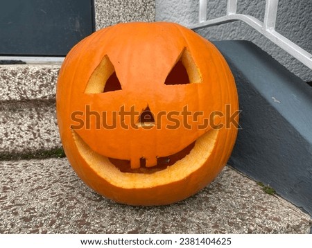 a carved orange Halloween pumpkin